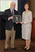 Paul Coates receives award from ASN President Teresa Davis.